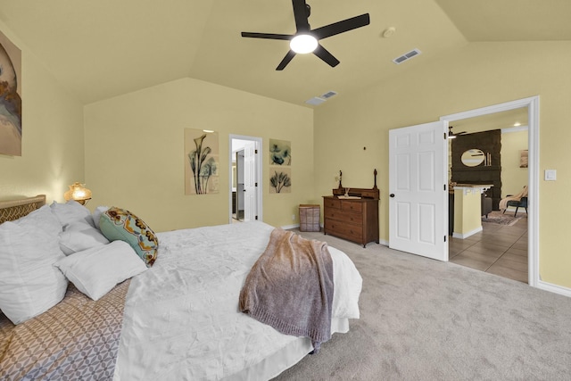 carpeted bedroom featuring lofted ceiling and ceiling fan