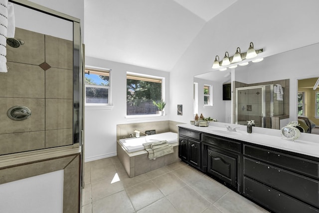 bathroom featuring lofted ceiling, tile patterned flooring, plus walk in shower, and a healthy amount of sunlight