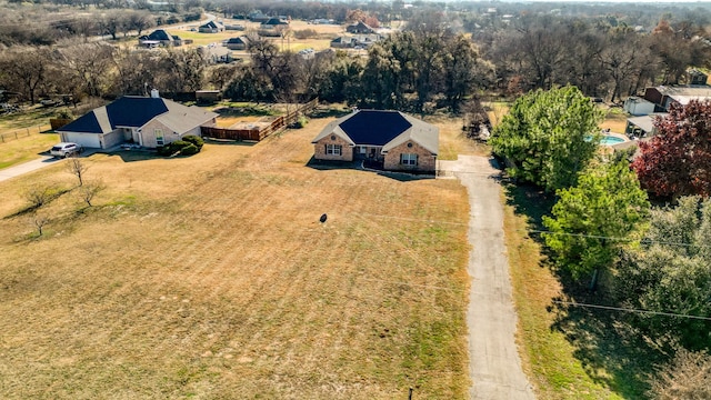 birds eye view of property with a rural view