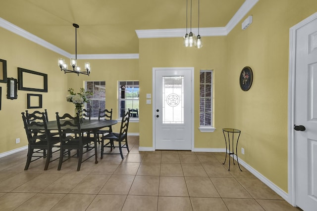 tiled dining area featuring ornamental molding and an inviting chandelier