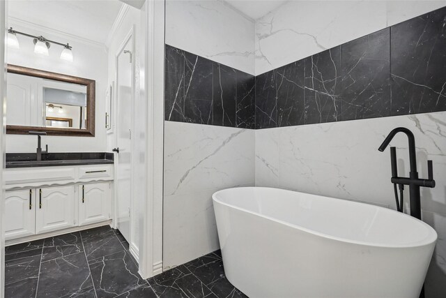 bathroom featuring crown molding, vanity, a bath, and tile walls