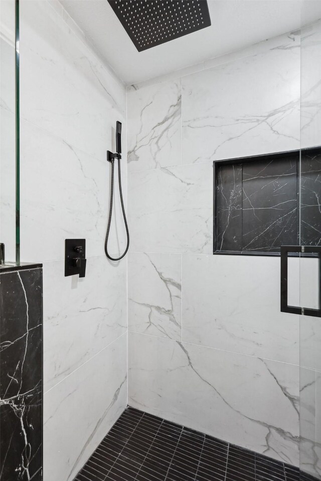 interior space with tiled shower