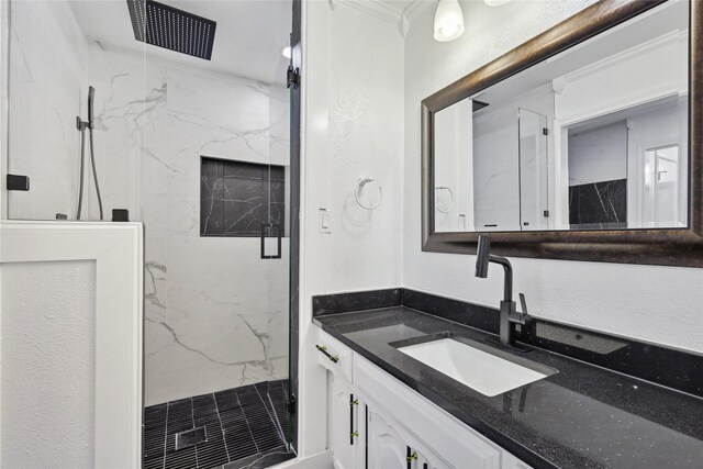 bathroom featuring vanity and an enclosed shower