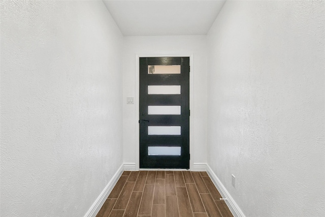 doorway to outside featuring wood-type flooring