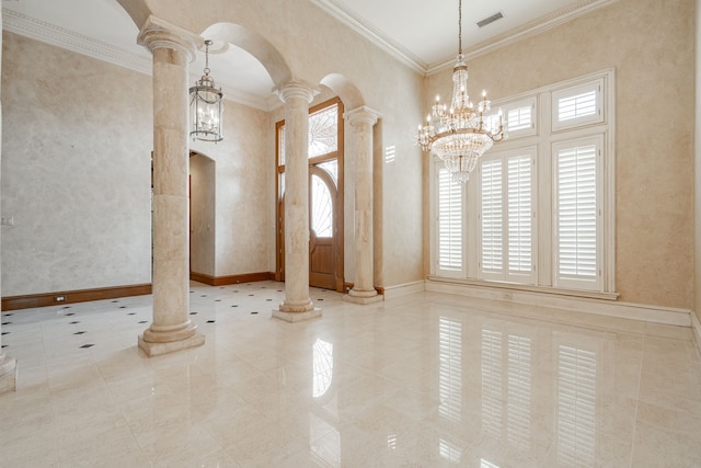 interior space with ornate columns, a notable chandelier, and crown molding