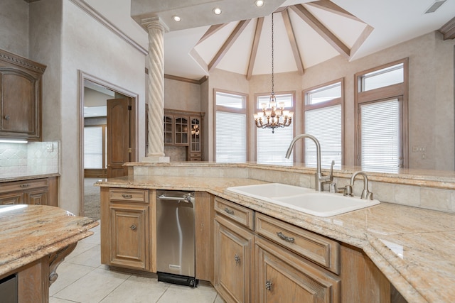 kitchen with backsplash, vaulted ceiling, sink, decorative light fixtures, and a notable chandelier