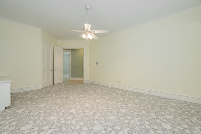 empty room with crown molding and ceiling fan