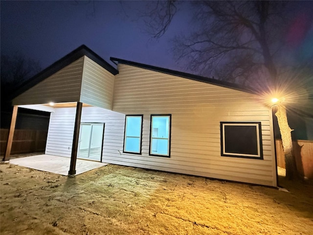 back of property featuring a patio area