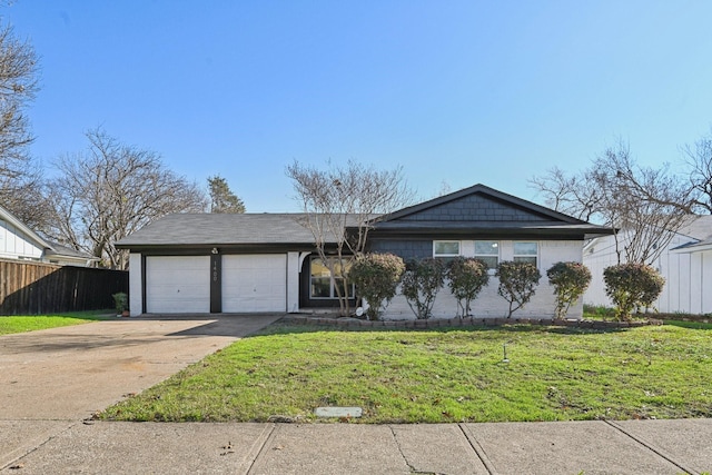 ranch-style home with a garage and a front lawn