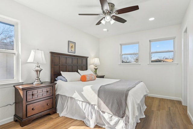 bedroom featuring hardwood / wood-style flooring and ceiling fan