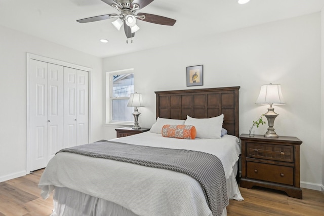 bedroom featuring ceiling fan, a closet, and wood-type flooring