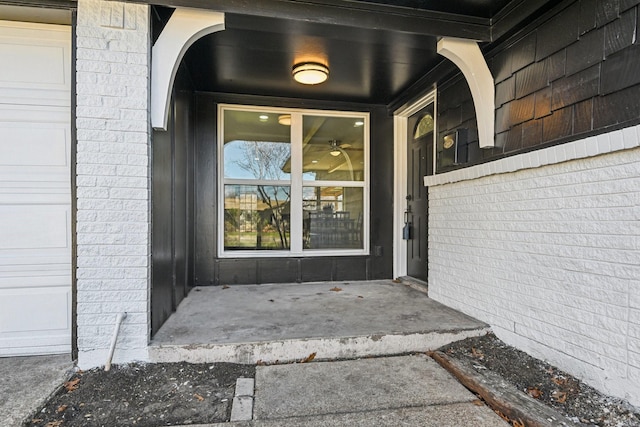 view of exterior entry with a garage