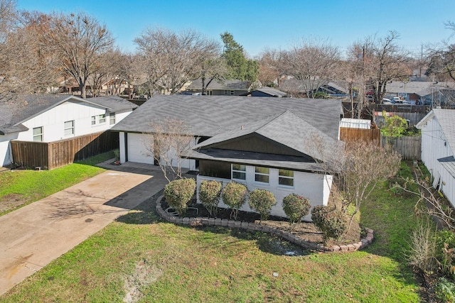 view of front of home featuring a garage and a front yard