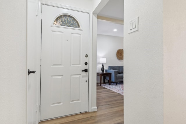 foyer entrance with light hardwood / wood-style floors