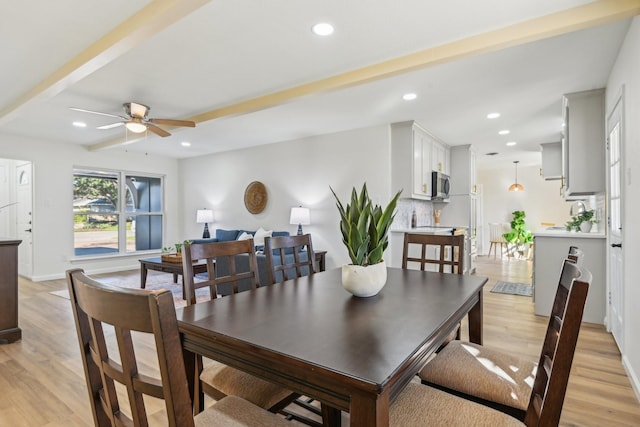 dining room featuring ceiling fan and light hardwood / wood-style flooring