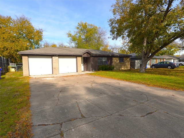 single story home featuring a garage and a front lawn