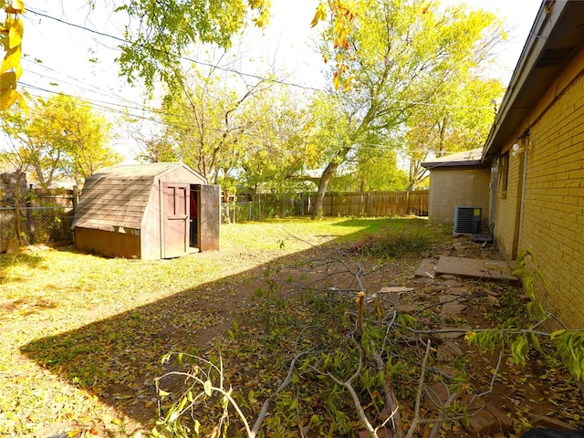 view of yard featuring a storage unit and cooling unit