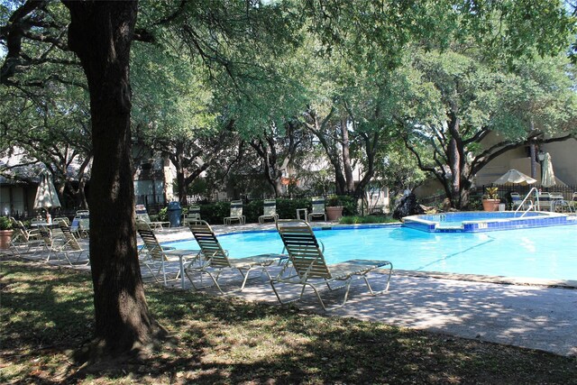 view of community with a swimming pool