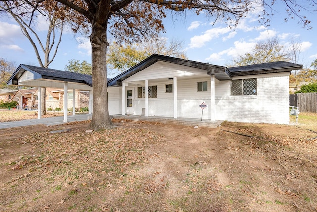 rear view of property with a porch