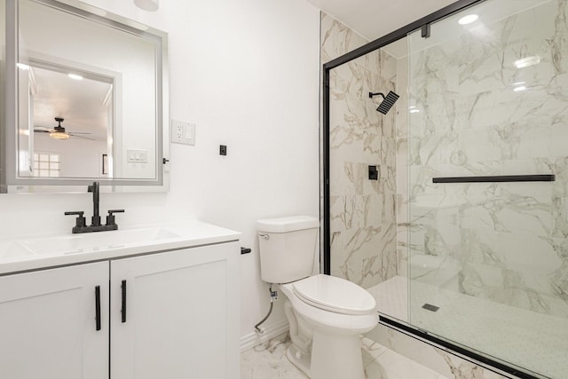 bathroom featuring ceiling fan, vanity, an enclosed shower, and toilet