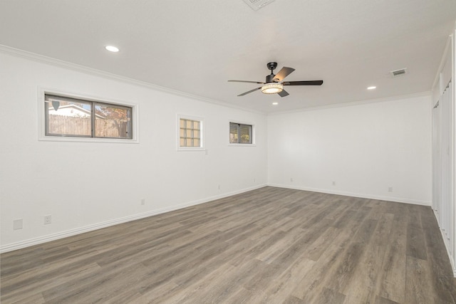 empty room featuring crown molding, ceiling fan, and hardwood / wood-style flooring