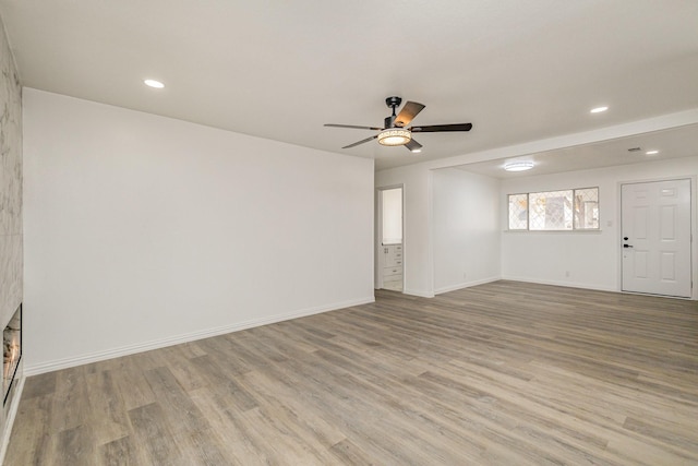 spare room featuring ceiling fan and light wood-type flooring