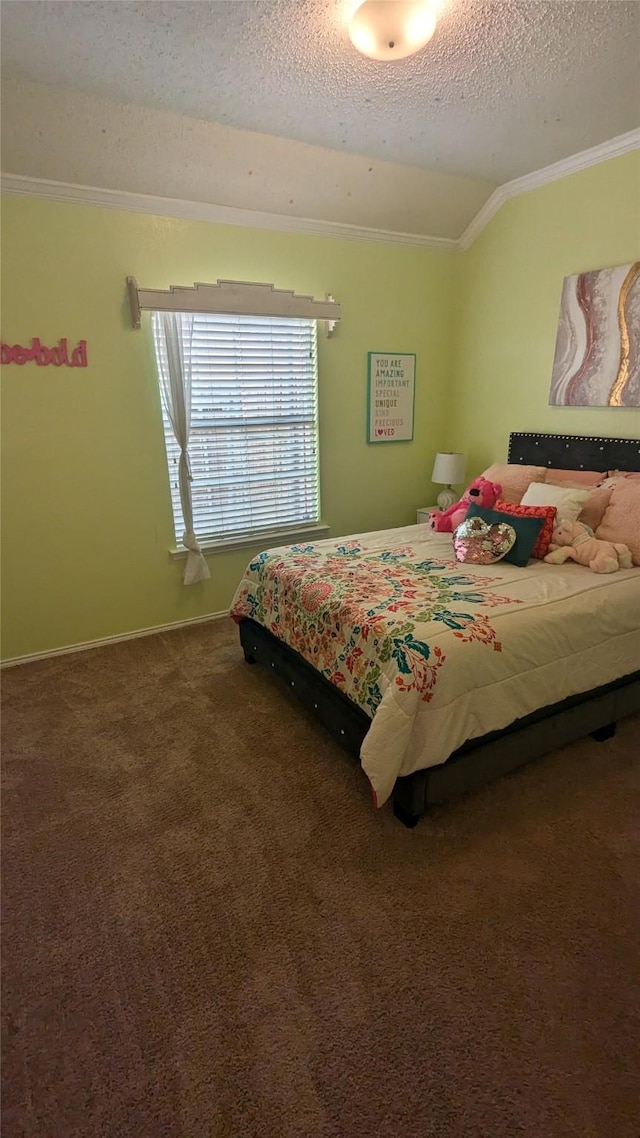 carpeted bedroom with a textured ceiling and ornamental molding