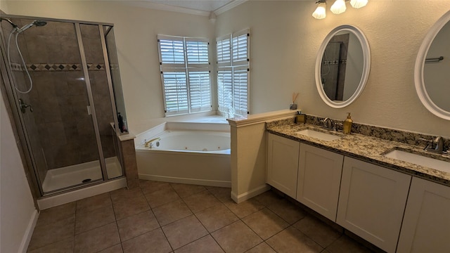 bathroom featuring tile patterned floors, vanity, separate shower and tub, and crown molding