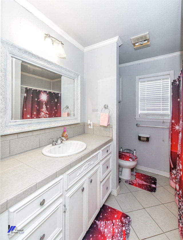 bathroom with tile patterned flooring, vanity, toilet, and ornamental molding