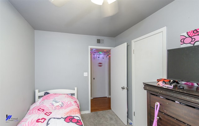 carpeted bedroom with ceiling fan