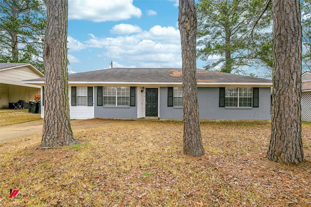 ranch-style home featuring a carport