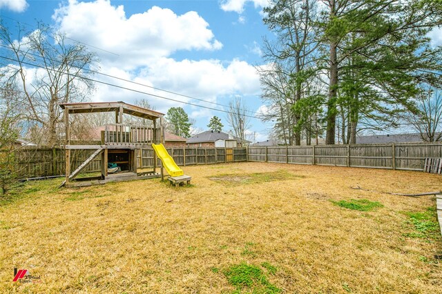 back of house featuring a lawn, a patio area, and central AC