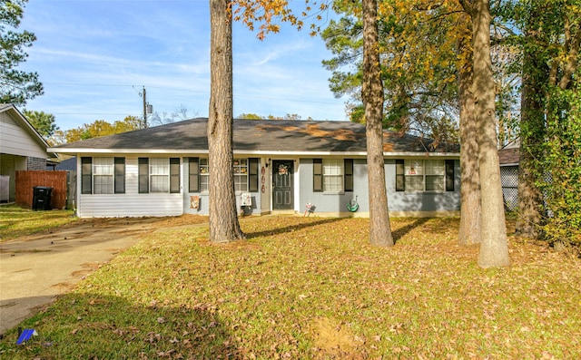 ranch-style house with a front lawn