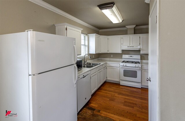 kitchen featuring white cabinetry, dark hardwood / wood-style flooring, crown molding, and white appliances