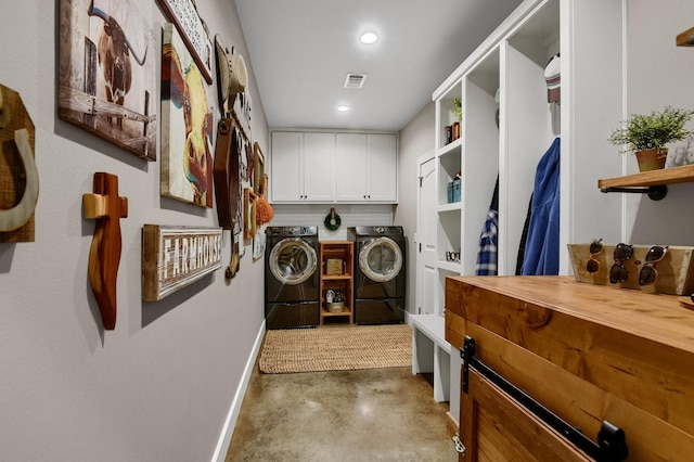 laundry area featuring cabinets and separate washer and dryer