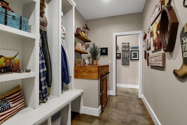 mudroom featuring concrete floors