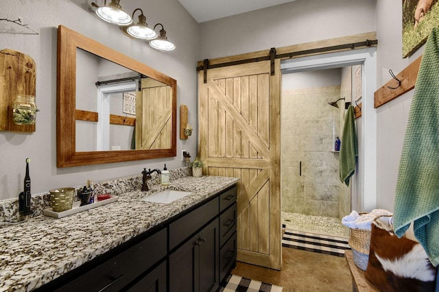 bathroom with vanity and a shower with shower door