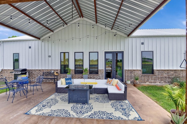 view of patio featuring an outdoor living space, grilling area, and french doors