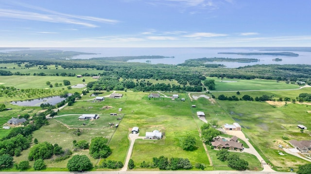 drone / aerial view with a rural view and a water view