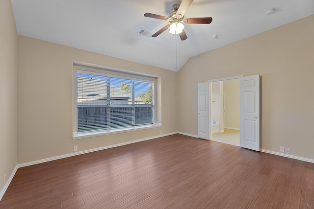 unfurnished room featuring ceiling fan, hardwood / wood-style floors, and vaulted ceiling