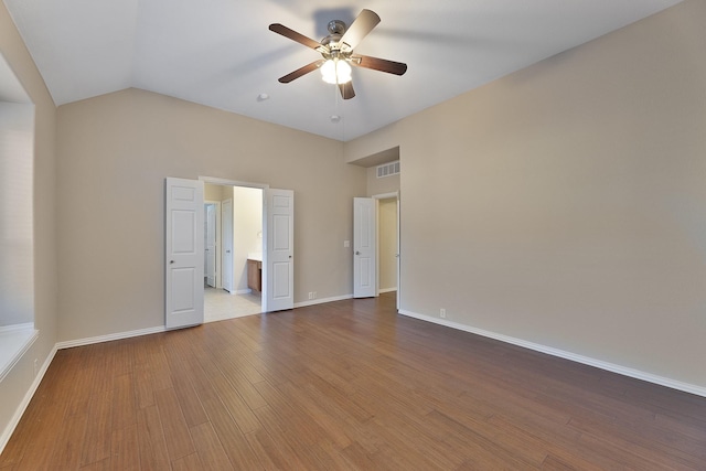 unfurnished room featuring wood-type flooring, ceiling fan, and lofted ceiling