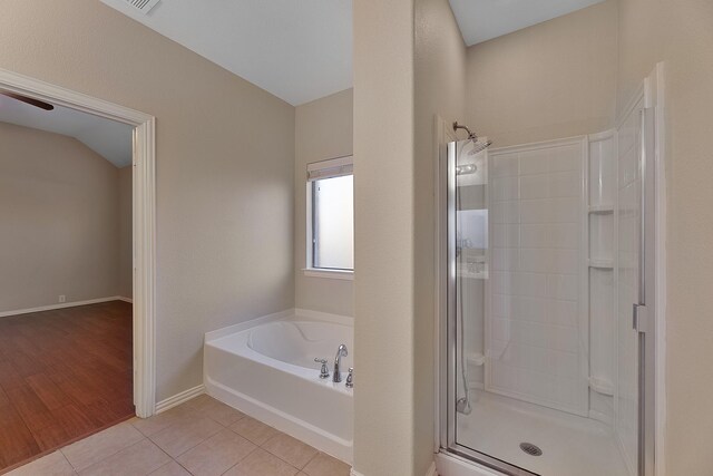 bathroom featuring shower with separate bathtub and hardwood / wood-style flooring