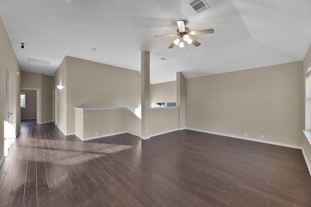 unfurnished living room featuring ceiling fan, lofted ceiling, and dark wood-type flooring