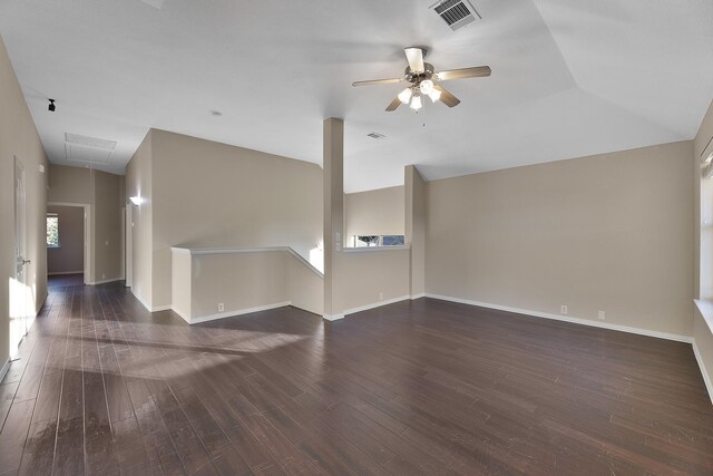 unfurnished living room featuring ceiling fan, lofted ceiling, and dark wood-type flooring