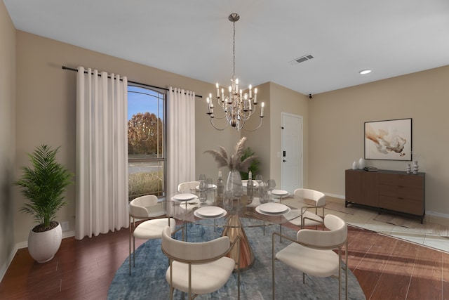 dining room featuring a notable chandelier and dark hardwood / wood-style floors