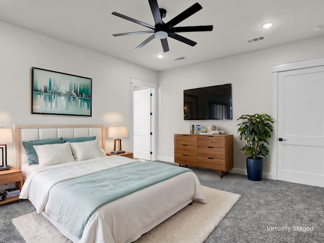 bedroom with ceiling fan and carpet