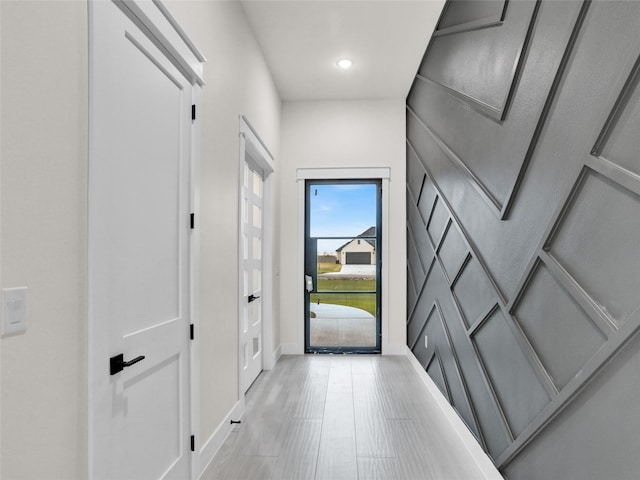 doorway to outside featuring light wood-type flooring