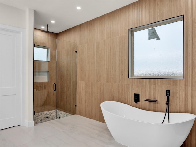 bathroom with shower with separate bathtub