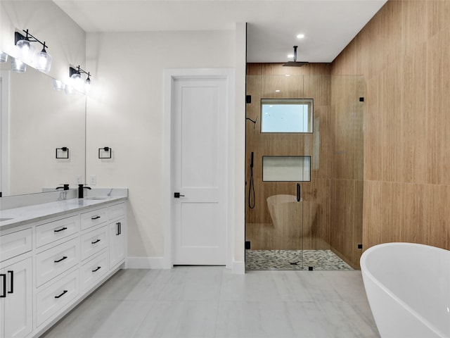 bathroom featuring tile patterned floors, vanity, and separate shower and tub