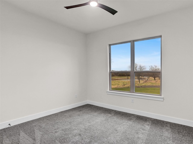 empty room featuring carpet and ceiling fan